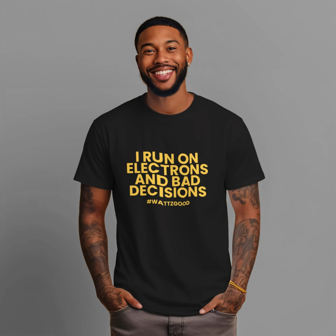 Man wearing the black Wattz Good "I Run on Electrons and Bad Decisions" EV graphic tee