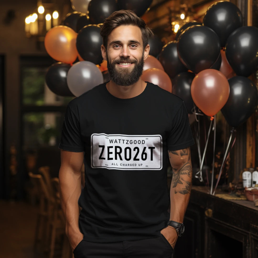 Man wearing the black Wattz Good ZERO26T license plate tee with WATTZGOOD and All Charged Up on the plate