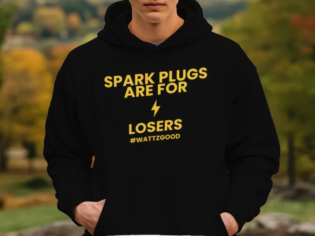 Person wearing the black Wattz Good Spark Plugs Are for Losers EV hoodie, lifestyle photo